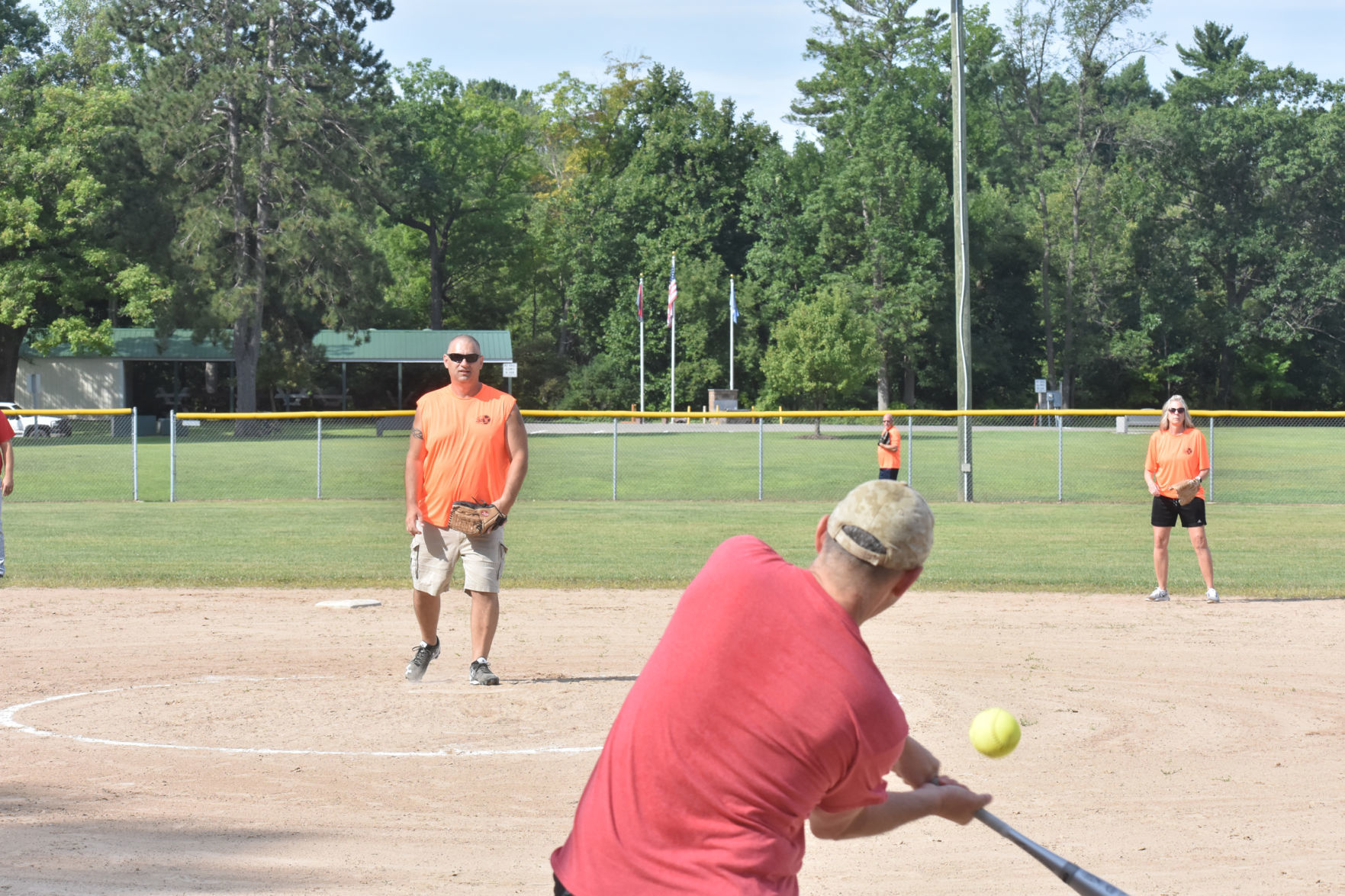 Batter hits softball at tournament
